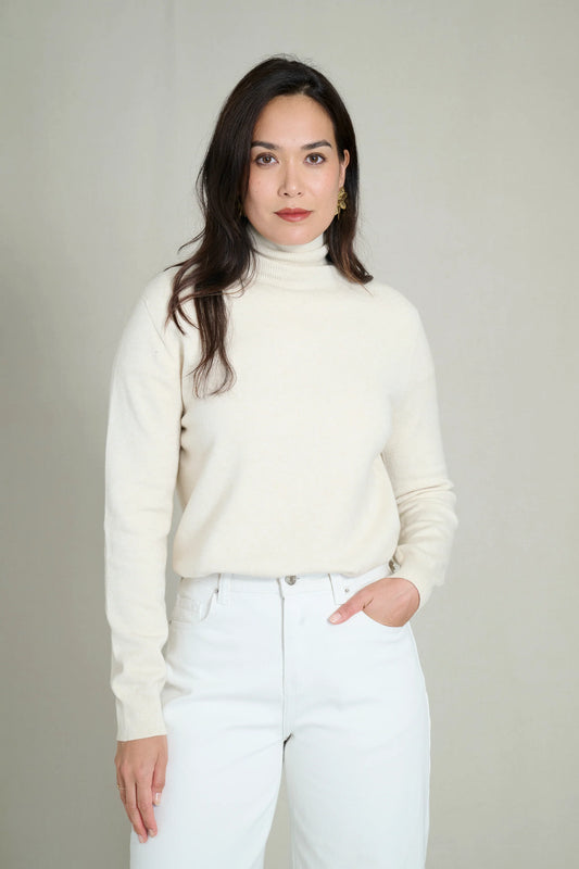 Cream fine knit seamless turtleneck sweater 1
